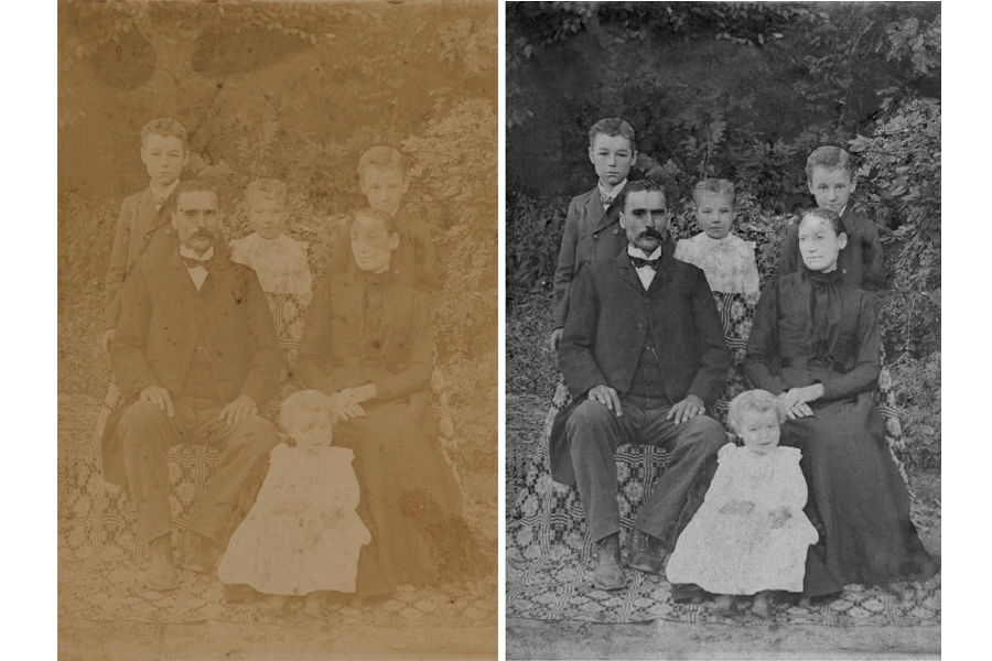 This an example of a photograph restored by Brian Charles Steel Photography.  This image was faded, and had stains and tears. The restored photo depicts a family sitting outside. The young daughter is in front.  The father is on the left and the mother is on the right.  The two sons and other daughter are in the back row.  They are all wearing church clothes.  The background is filled with trees. 